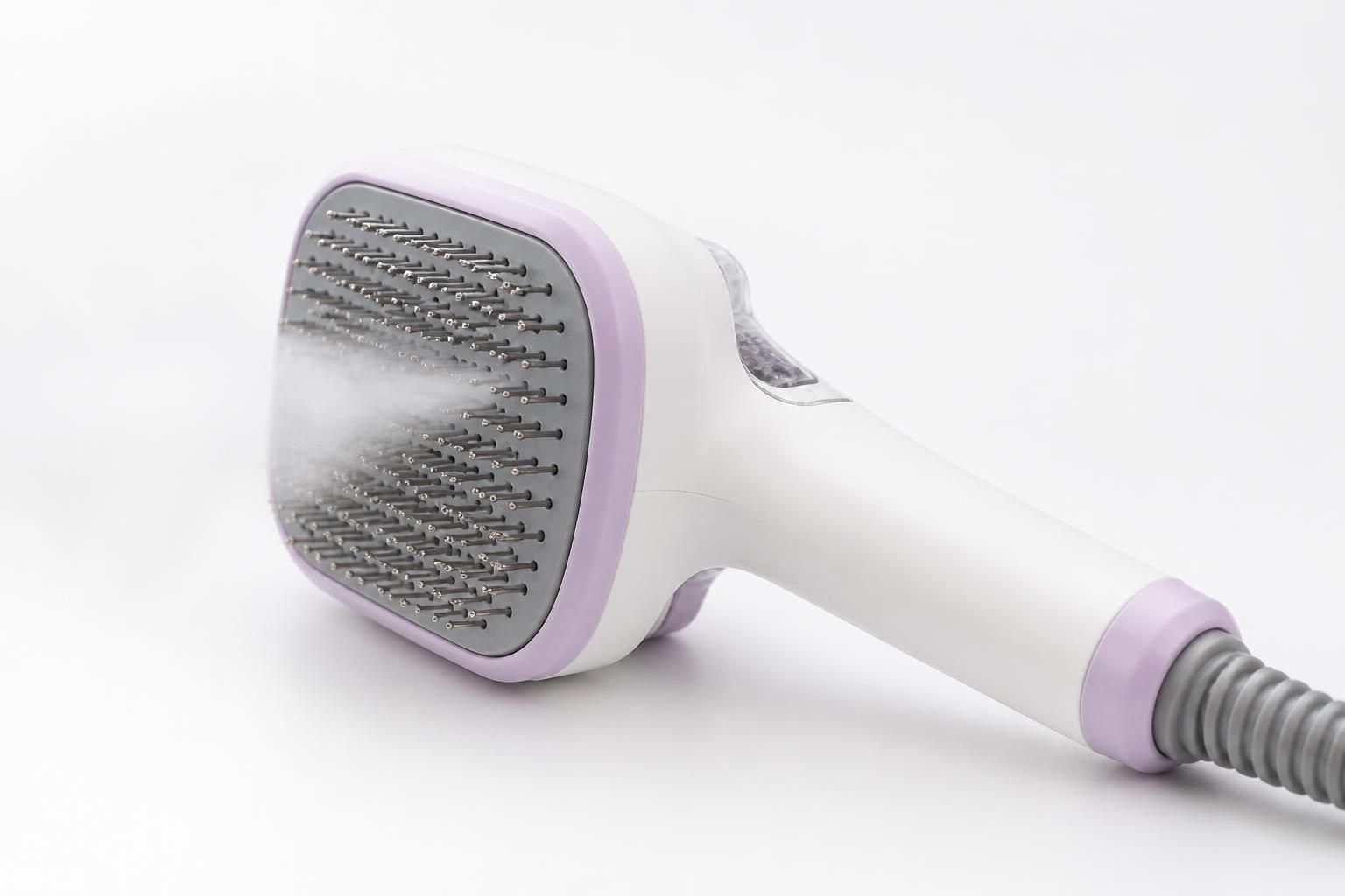 Brushed pet grooming tool with steam mist