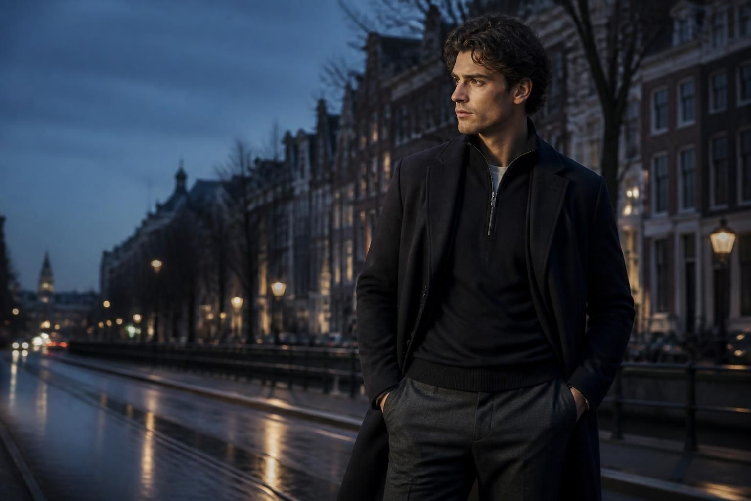 ICON Amsterdam menswear campaign hero with a sharply dressed male model on a city street at dusk