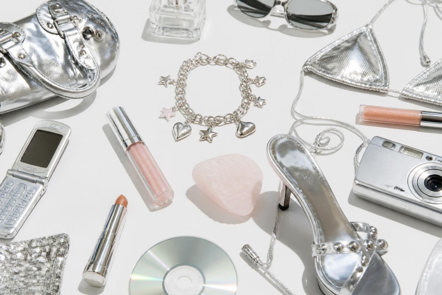 A high-key Y2K mood collage of glossy metallic textures
