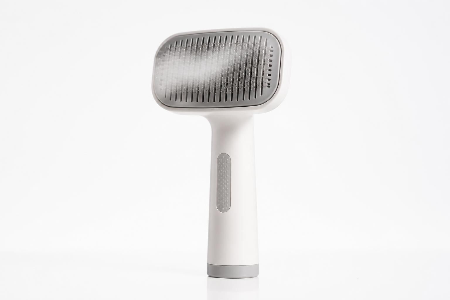 Brushed pet grooming tool with steam mist